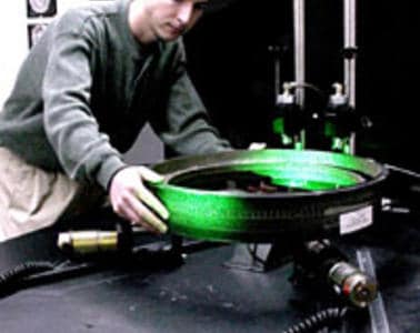 Man using Holography technology to inspect a wheel