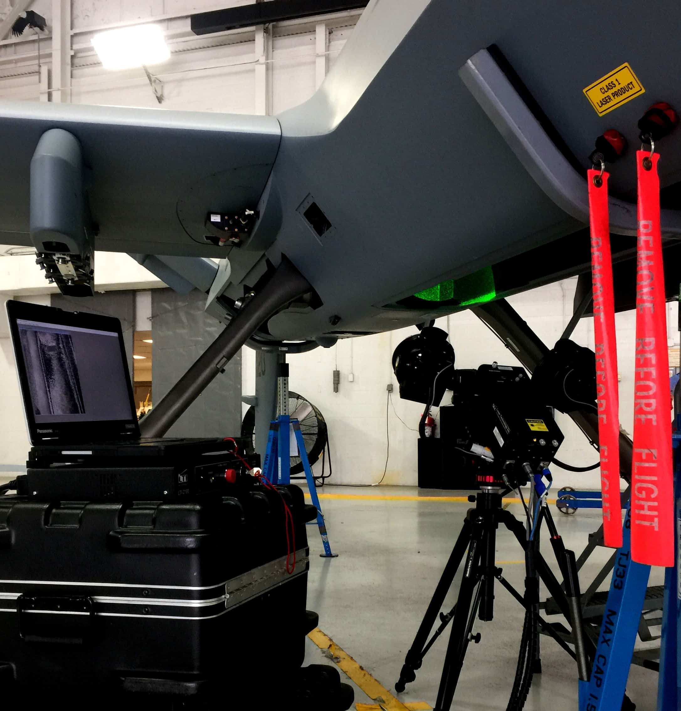 Tripod mounted LTI-2100 Shearography Camera scanning aircraft for impact damage