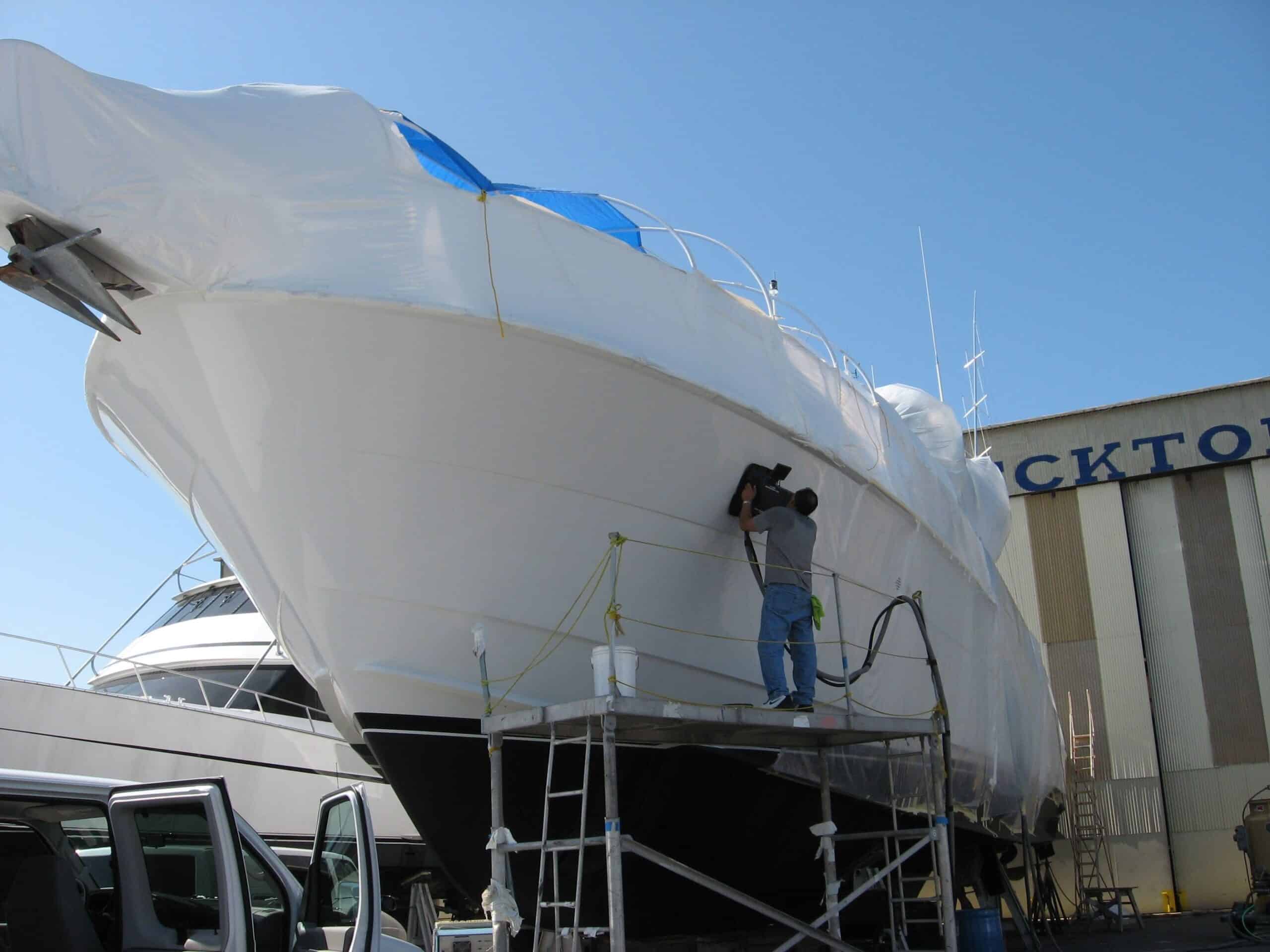 Man performing Shearography nondestructive testing on a yacht